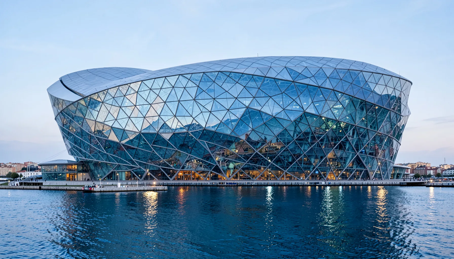 Harpa concert hall exterior with its distinctive geometric glass facade reflecting the harbor, cool blue and silver tones